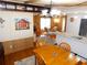 Open-concept living area with dining table and view into the kitchen at 36901 Tara Ave, Zephyrhills, FL 33542