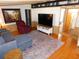 Well-lit living room with hardwood floors, cozy seating, and neutral decor at 36901 Tara Ave, Zephyrhills, FL 33542