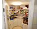 Pantry area with tiled floor, shelving, and countertop space for organized storage at 36901 Tara Ave, Zephyrhills, FL 33542