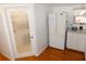 Kitchen pantry with refrigerator and granite countertops, as well as an ornate glass pantry door at 36901 Tara Ave, Zephyrhills, FL 33542