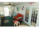 Cozy sunroom featuring a seating area, ceiling fan, and access to the outdoors at 36901 Tara Ave, Zephyrhills, FL 33542