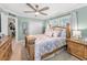 Spacious bedroom with a ceiling fan, closet and soft, natural light at 4191 Maple Ne St, St Petersburg, FL 33703