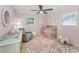 Charming pink Bedroom with a crib, rocking chair, and decorative accents at 4191 Maple Ne St, St Petersburg, FL 33703
