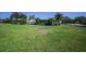 Expansive front yard with lush green grass, showcasing the home's curb appeal and generous outdoor space at 4191 Maple Ne St, St Petersburg, FL 33703