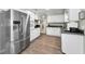 Well-equipped kitchen featuring stainless steel appliances, white cabinetry, and ample counter space for cooking and meal prep at 4191 Maple Ne St, St Petersburg, FL 33703