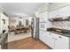 Modern kitchen and dining area featuring stainless steel appliances and a stylish backsplash at 4191 Maple Ne St, St Petersburg, FL 33703
