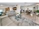Open-concept living and dining areas with stylish furniture and bright, airy space perfect for entertaining guests at 4191 Maple Ne St, St Petersburg, FL 33703