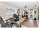 Bright office space with large desk, ceiling fan, and access to outdoor patio at 4191 Maple Ne St, St Petersburg, FL 33703