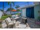 Outdoor patio area with comfortable seating and a view of the well maintained backyard at 4191 Maple Ne St, St Petersburg, FL 33703