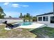 Inviting backyard showcasing a refreshing pool and comfortable lounge chairs at 4710 Travertine Dr, Tampa, FL 33615