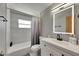 The bathroom offers a tub, illuminated mirror, and modern fixtures at 4710 Travertine Dr, Tampa, FL 33615