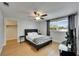 This bedroom features a ceiling fan, television, and natural light at 4710 Travertine Dr, Tampa, FL 33615