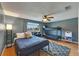 This bedroom features a queen bed, bunk bed, ceiling fan, and natural light at 4710 Travertine Dr, Tampa, FL 33615
