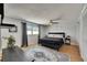 Cozy bedroom with a ceiling fan, a queen size bed, and a decorative area rug at 4710 Travertine Dr, Tampa, FL 33615