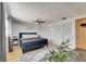 This bedroom features a ceiling fan, large closet, accent wall art, and plenty of natural light at 4710 Travertine Dr, Tampa, FL 33615