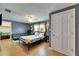 Charming bedroom features wood floors, natural light, and a spacious layout at 4710 Travertine Dr, Tampa, FL 33615