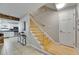 Welcoming entryway features stairs and a view into the updated kitchen at 4710 Travertine Dr, Tampa, FL 33615