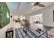 Open concept game room with ping pong table, bar, and view into the kitchen at 4710 Travertine Dr, Tampa, FL 33615