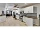 Updated kitchen with stainless steel appliances and white cabinets at 4710 Travertine Dr, Tampa, FL 33615