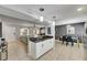 Well-designed living space with an open layout featuring a combined kitchen, dining, and living area for a spacious feel at 4710 Travertine Dr, Tampa, FL 33615