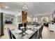 Open-concept living space showcasing the dining table, kitchen and cozy living area with windows for natural light at 4710 Travertine Dr, Tampa, FL 33615