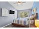 Serene bedroom with vaulted ceiling, ceiling fan, and view to the outside at 4734 67Th N Ave, Pinellas Park, FL 33781