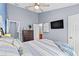 Comfortable bedroom featuring a TV, dresser, and an ensuite bathroom at 4734 67Th N Ave, Pinellas Park, FL 33781