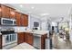 Modern kitchen with stainless steel appliances that opens to the dining and living areas at 4734 67Th N Ave, Pinellas Park, FL 33781