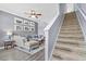 Inviting living room with stylish decor, staircase, and plenty of natural light at 4734 67Th N Ave, Pinellas Park, FL 33781