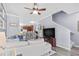 Spacious living room with hardwood floors, a sectional sofa, and open access to the kitchen area at 4734 67Th N Ave, Pinellas Park, FL 33781