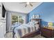 Cozy main bedroom with a scenic view of the lake and water fountain at 4734 67Th N Ave, Pinellas Park, FL 33781