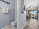 Charming half bath with beach decor and views to the eat-in kitchen and screened-in patio at 4734 67Th N Ave, Pinellas Park, FL 33781