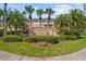 Inviting entrance to Sawgrass Village surrounded by lush greenery and tropical palm trees at 4734 67Th N Ave, Pinellas Park, FL 33781