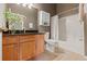 Cozy bathroom featuring a shower-tub combination with a white tile surround and a wood vanity at 5127 6Th N Way, St Petersburg, FL 33703