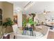 Open-concept living space with a dining room, kitchen, and living room area with fan and staircase at 5127 6Th N Way, St Petersburg, FL 33703