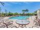 Resort-style pool with comfortable lounge seating and swaying palm trees for relaxing afternoons at 5127 6Th N Way, St Petersburg, FL 33703