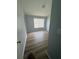Bedroom with updated flooring, neutral walls and natural light at 6025 Osprey Lake Cir, Riverview, FL 33578