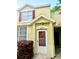 Charming townhome featuring an inviting front door with address and colorful landscaping at 6025 Osprey Lake Cir, Riverview, FL 33578