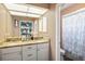 Bathroom with double vanity, granite countertops, and a walk-in shower at 6118 Becklin Pl, Riverview, FL 33578