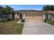 Charming single-story home with a well-manicured lawn and attached two-car garage in a lovely neighborhood at 6118 Becklin Pl, Riverview, FL 33578