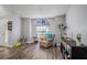 Bright living room showcasing tile flooring, a stained glass window, and cozy seating at 6118 Becklin Pl, Riverview, FL 33578