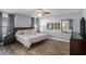 Serene main bedroom featuring wood floors and ample natural light at 6118 Becklin Pl, Riverview, FL 33578