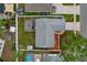 Aerial view of a home showcasing a backyard with a patio, shed, and a well-manicured lawn at 6471 109Th N Ter, Pinellas Park, FL 33782
