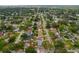 Aerial shot of a residential area with lush trees showcasing a home circled in red at 6471 109Th N Ter, Pinellas Park, FL 33782