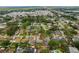 Birds-eye view of a neighborhood, highlighting a home with backyard pool circled in red at 6471 109Th N Ter, Pinellas Park, FL 33782