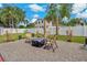 Serene backyard featuring a cozy gravel patio, perfect for outdoor relaxation and entertaining at 6471 109Th N Ter, Pinellas Park, FL 33782