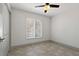 Neutral bedroom with tiled floor, ceiling fan, and a window with horizontal blinds at 6471 109Th N Ter, Pinellas Park, FL 33782