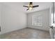 A bright bedroom with tile floors, neutral walls and a ceiling fan at 6471 109Th N Ter, Pinellas Park, FL 33782
