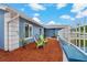 Relaxing side yard with vibrant mulch and green seating area at 6471 109Th N Ter, Pinellas Park, FL 33782