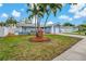 Beautiful home featuring well-maintained landscaping, a freshly painted exterior, and a manicured front yard at 6471 109Th N Ter, Pinellas Park, FL 33782